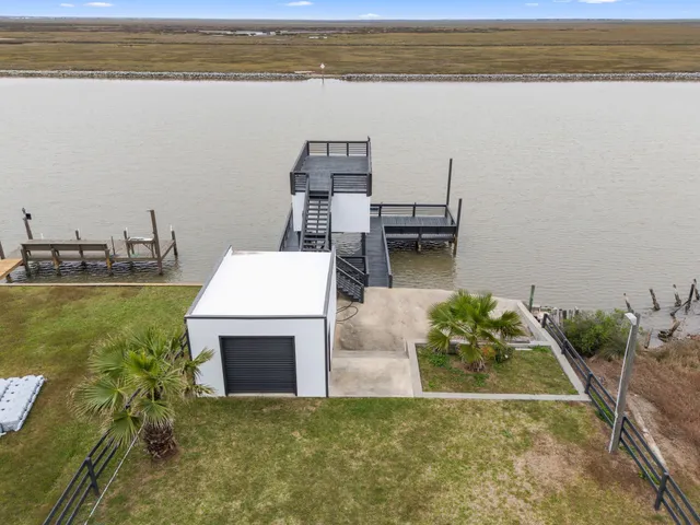 a view of a dining room kitchen with a table and chairs