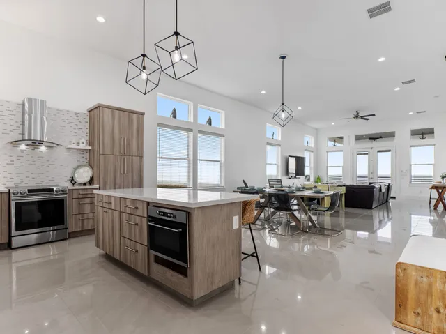 a kitchen with refrigerator cabinets and wooden floor