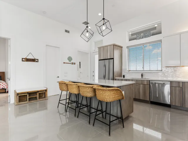 a spacious bedroom with a bed and a window