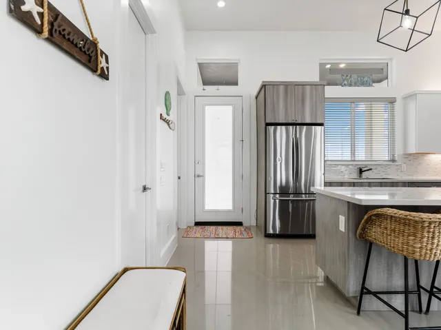 a spacious bedroom with a bed and a window