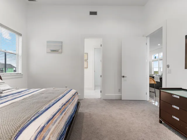 a bedroom with a bed and a closet