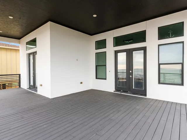 a view of an empty room with a balcony