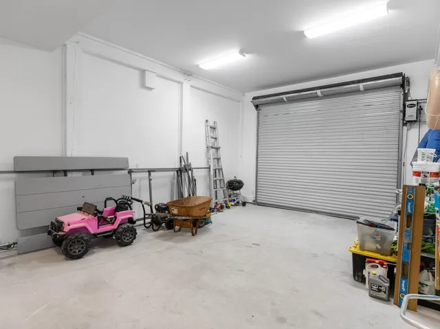 a view of a swimming pool with furniture