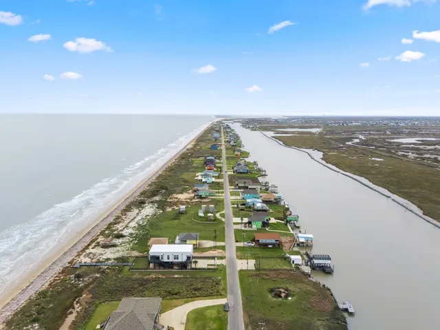 a view of a swimming pool and lounge chairs