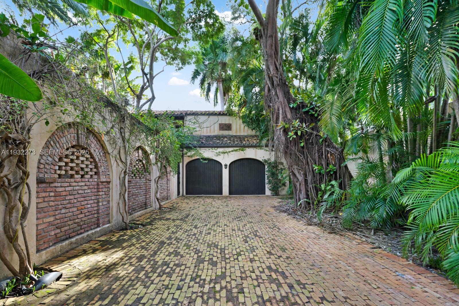 3467 North Moorings Way Miami, FL 33133 - Photo 25 of 25 a view of a house with a tree and a yard