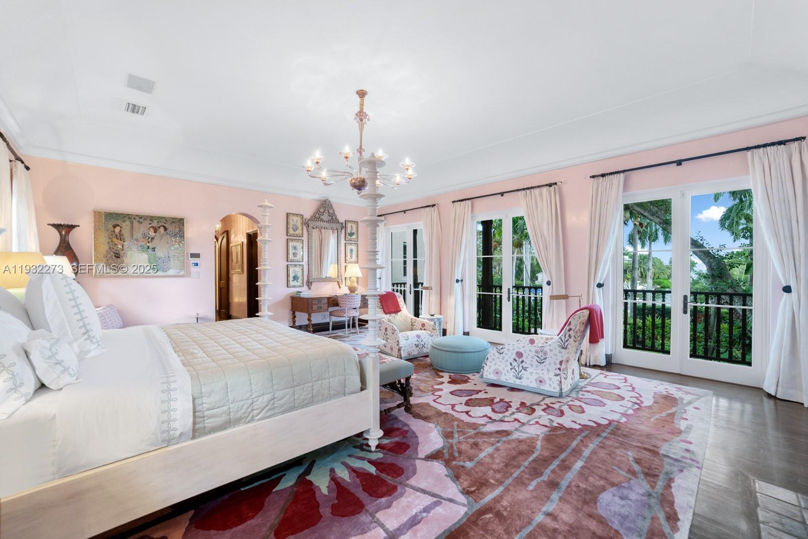 3467 North Moorings Way Miami, FL 33133 - Photo 6 of 25 a bedroom with a large bed and large windows