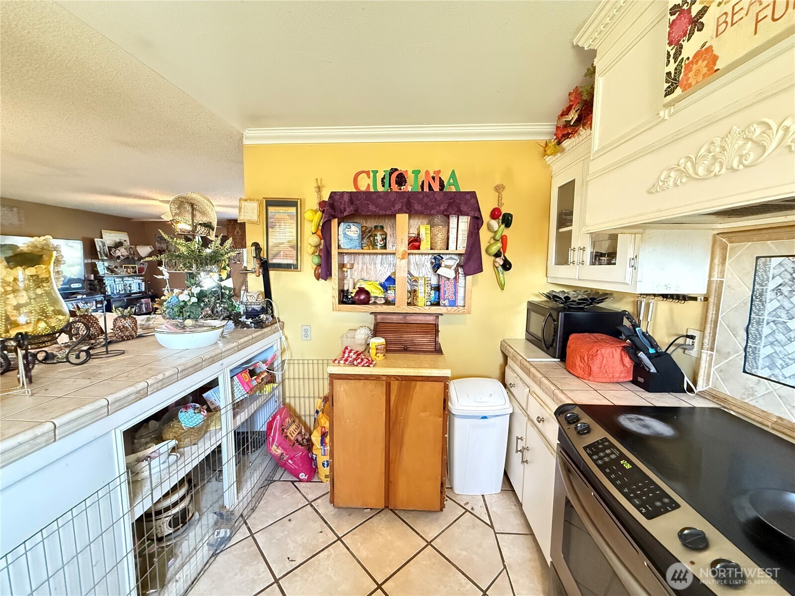 33 Greenacres Road Riverside, WA 98849 - Photo 13 of 35 a kitchen with stainless steel appliances kitchen island granite countertop a stove and a sink