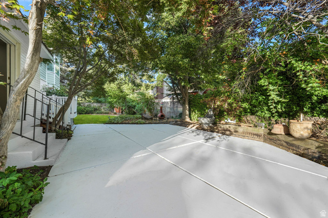8965 Quail Run Drive Sandy, UT 84093 - Photo 29 of 56 Fenced backyard featuring a patio