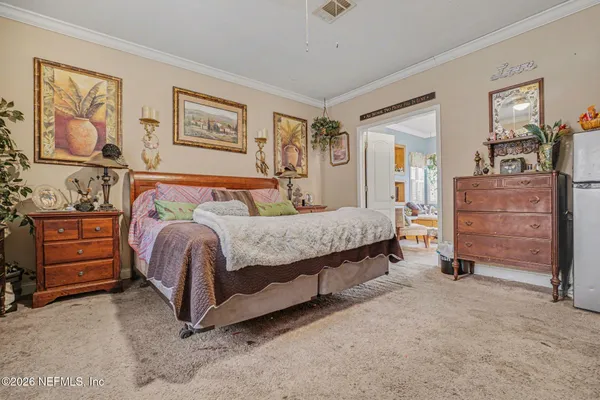 a bedroom with a bed and furniture