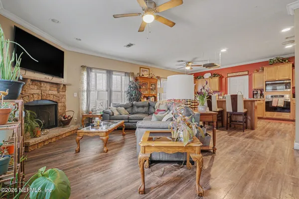 a living room with fireplace furniture and a flat screen tv