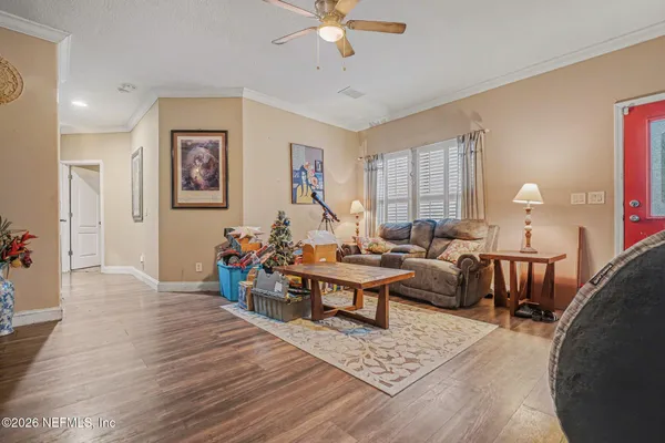 a living room with furniture and a large window