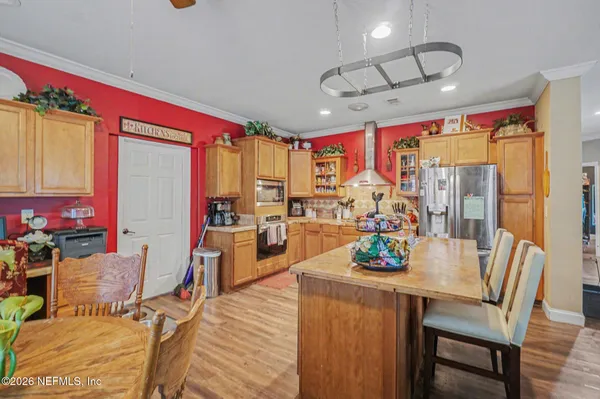 a view of a dining room with furniture window and outside view