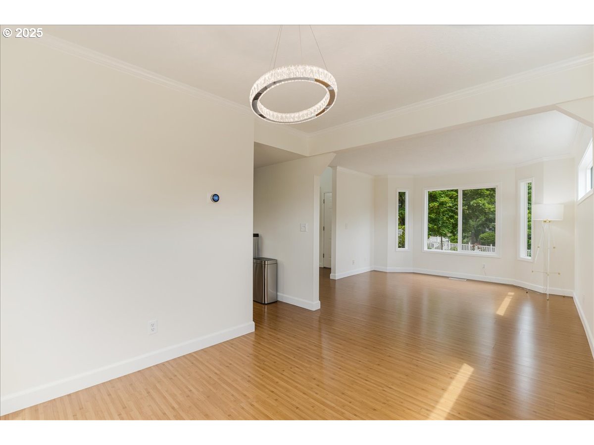 7505 Southwest Alpine Drive Beaverton, OR 97008 - Photo 16 of 48 a view of an empty room with wooden floor and a window