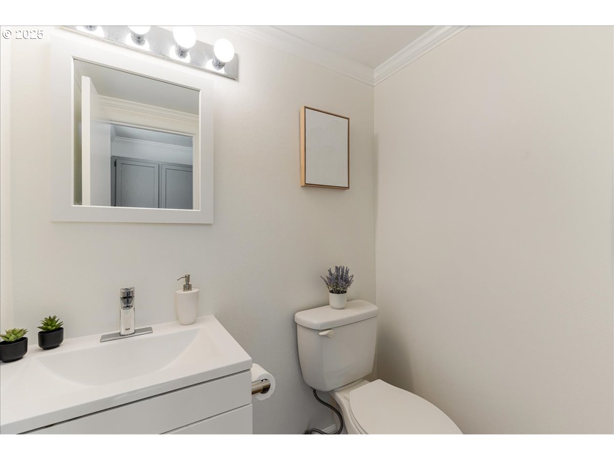7505 Southwest Alpine Drive Beaverton, OR 97008 - Photo 19 of 48 a bathroom with a sink mirror and toilet