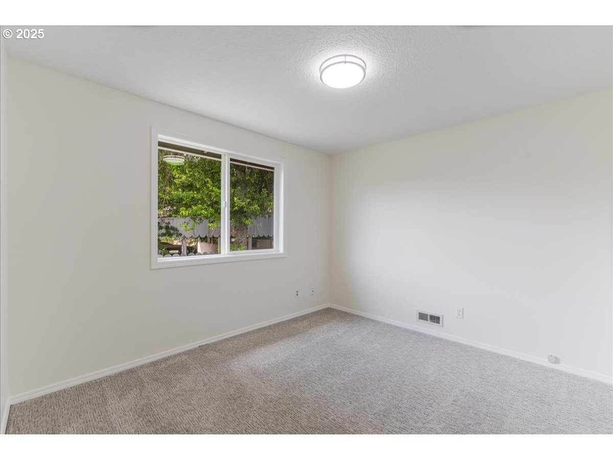 7505 Southwest Alpine Drive Beaverton, OR 97008 - Photo 28 of 48 a view of an empty room with a window