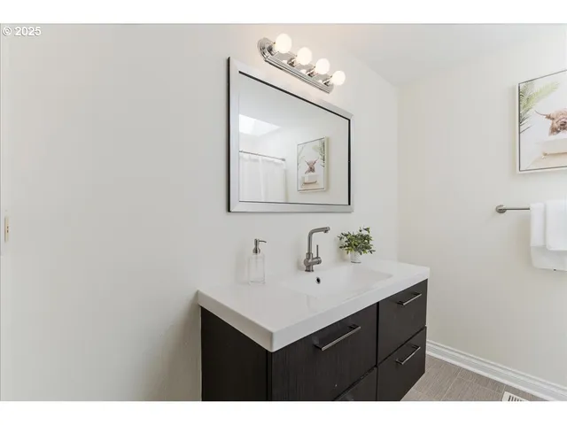 a bathroom with a shower and a shower curtain