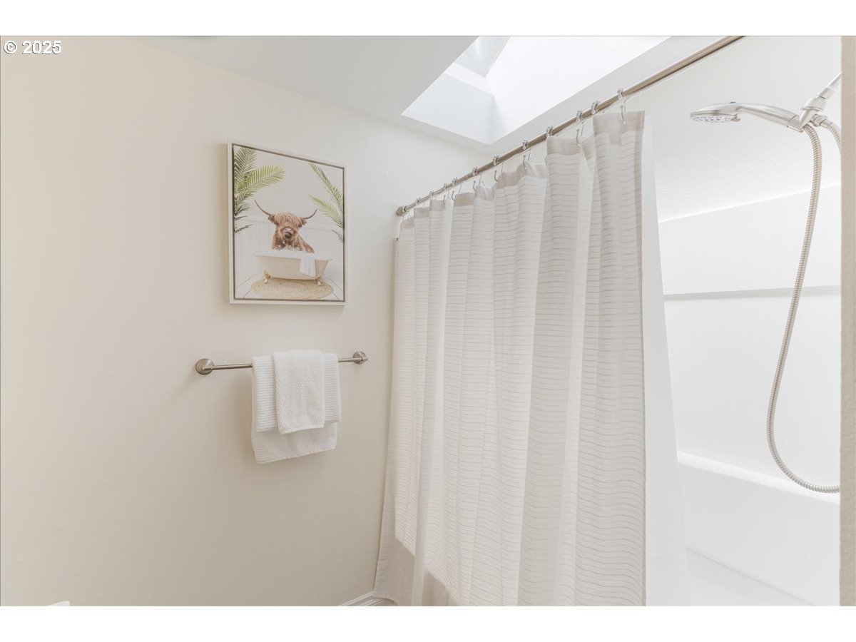 7505 Southwest Alpine Drive Beaverton, OR 97008 - Photo 30 of 48 a bathroom with a shower and a shower curtain