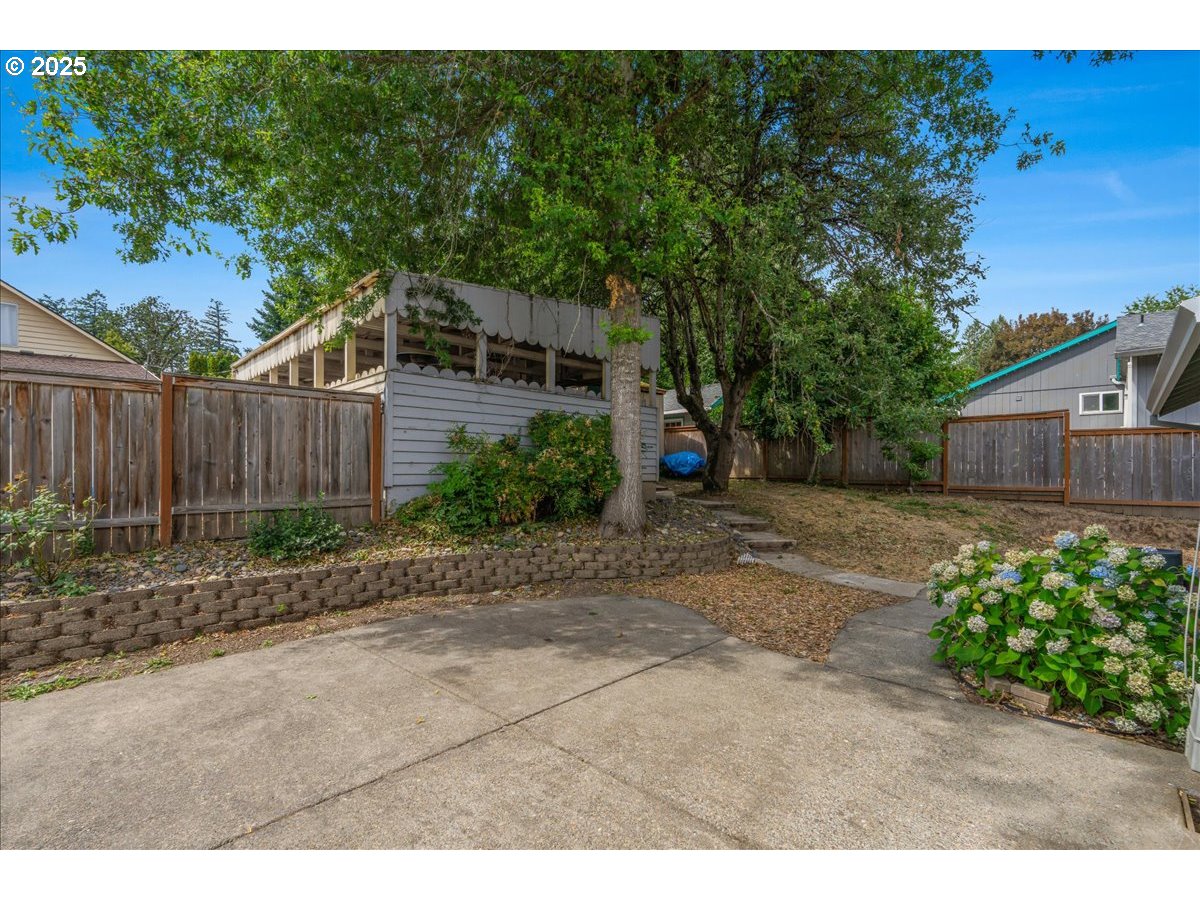 7505 Southwest Alpine Drive Beaverton, OR 97008 - Photo 31 of 48 a backyard of a house with lots of green space