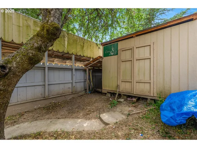 a view of field with trees in the background