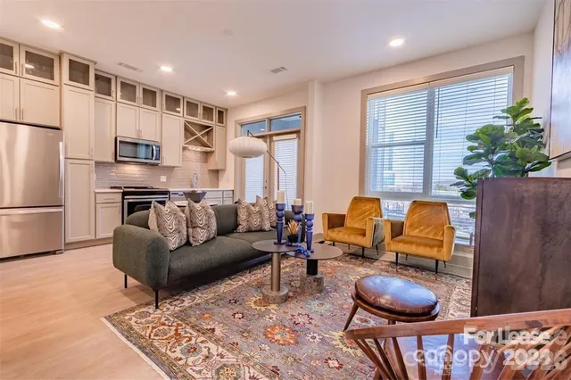 a bedroom with a bed potted plant with the window