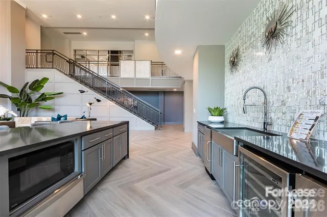a large kitchen with stainless steel appliances granite countertop a large counter top