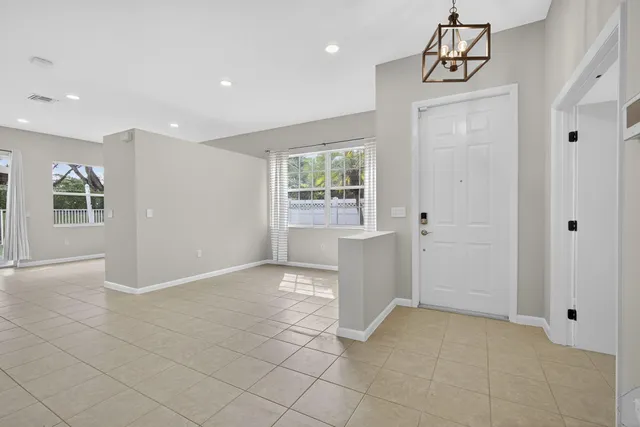 a view of an empty room with windows