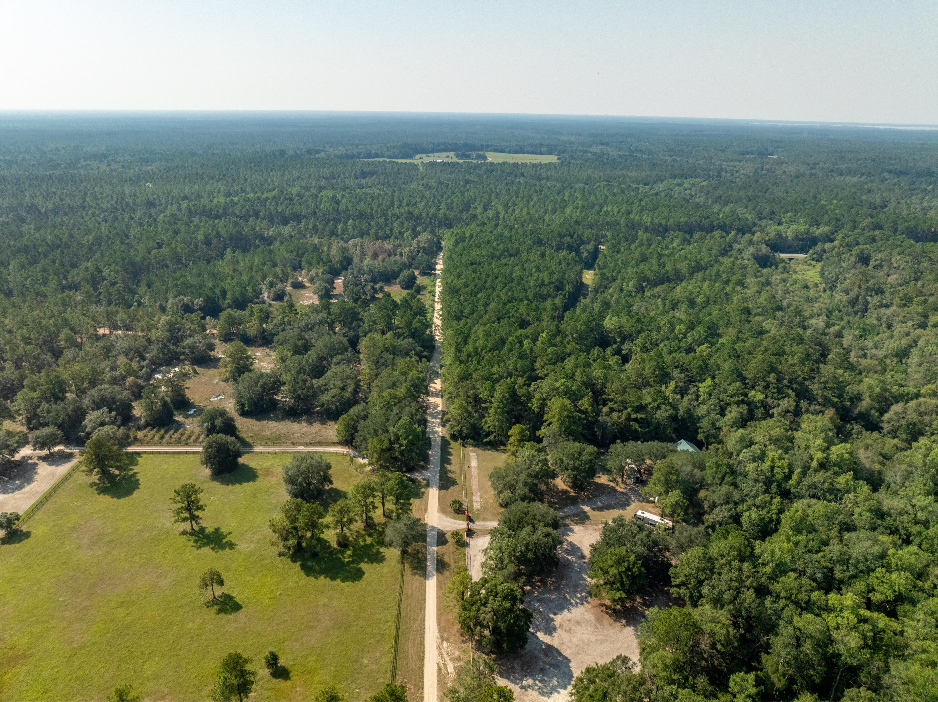 3717 Highway 20 Freeport, FL 32439 - Photo 20 of 21 an aerial view of residential houses with outdoor space and trees