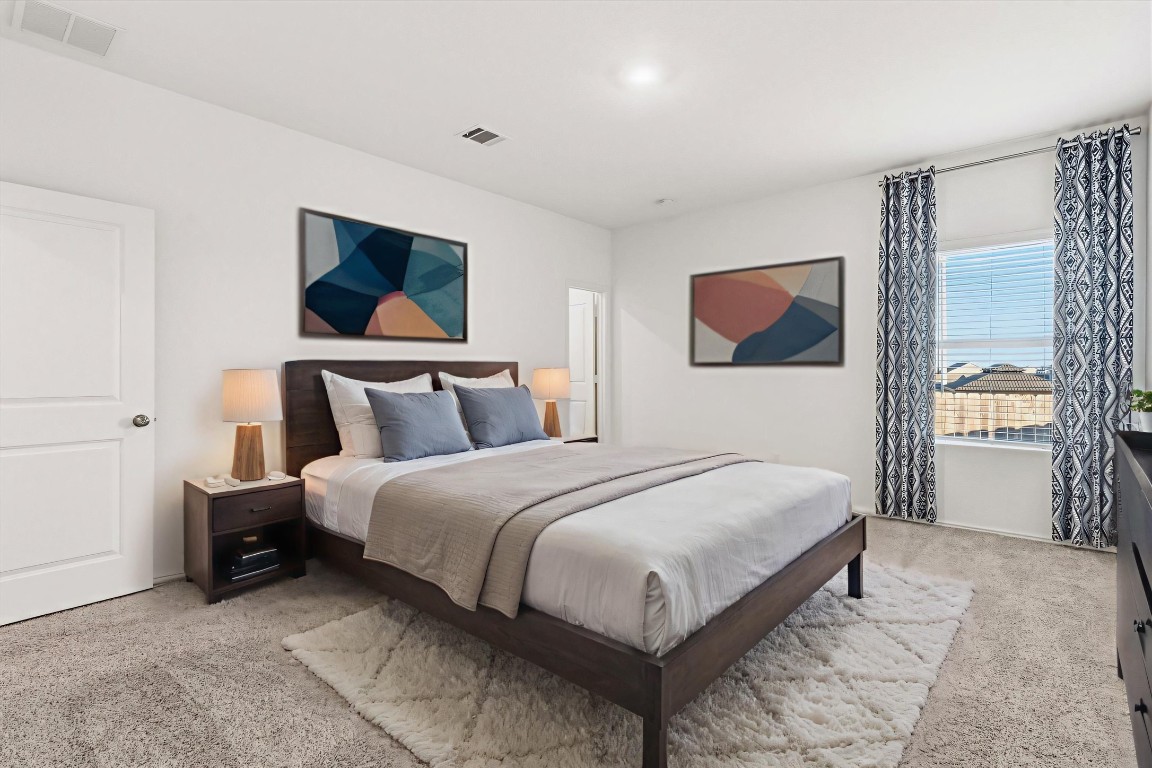 14105 Nightview Cove Pflugerville, TX 78660 - Photo 18 of 36 a bedroom with bed and large window