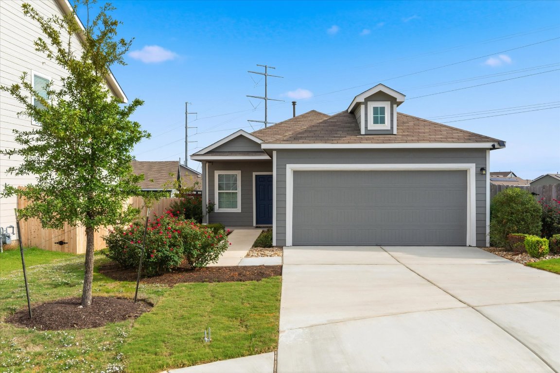 14105 Nightview Cove Pflugerville, TX 78660 - Photo 2 of 36 a front view of a house with a yard