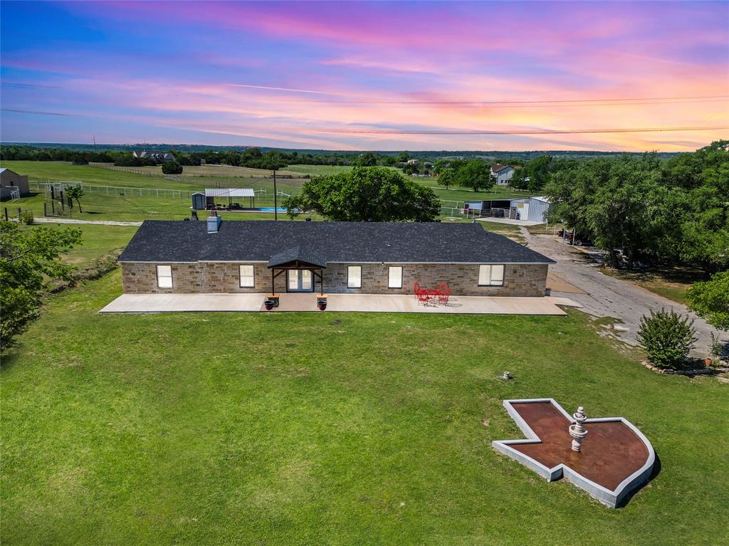 748 Rocky Ridge Lane Weatherford, TX 76085 - Photo 7 of 38 a view of a house with a yard