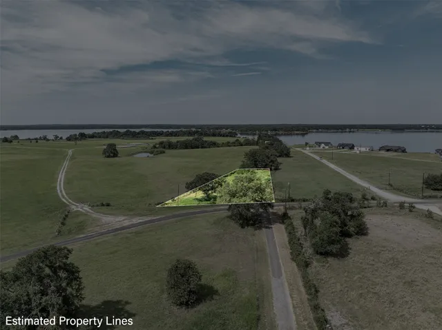 an aerial view of a residential houses with outdoor space