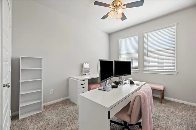 a workspace with furniture and window