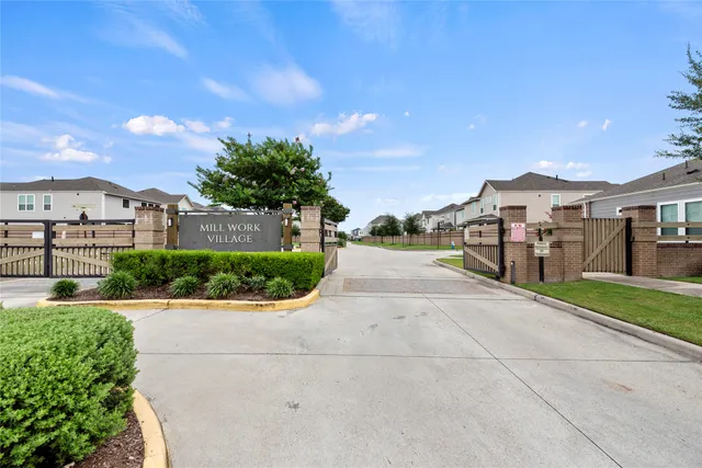 a view of a garden with a building in the background