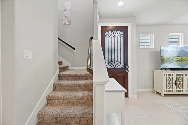 a view of an entryway with wooden floor