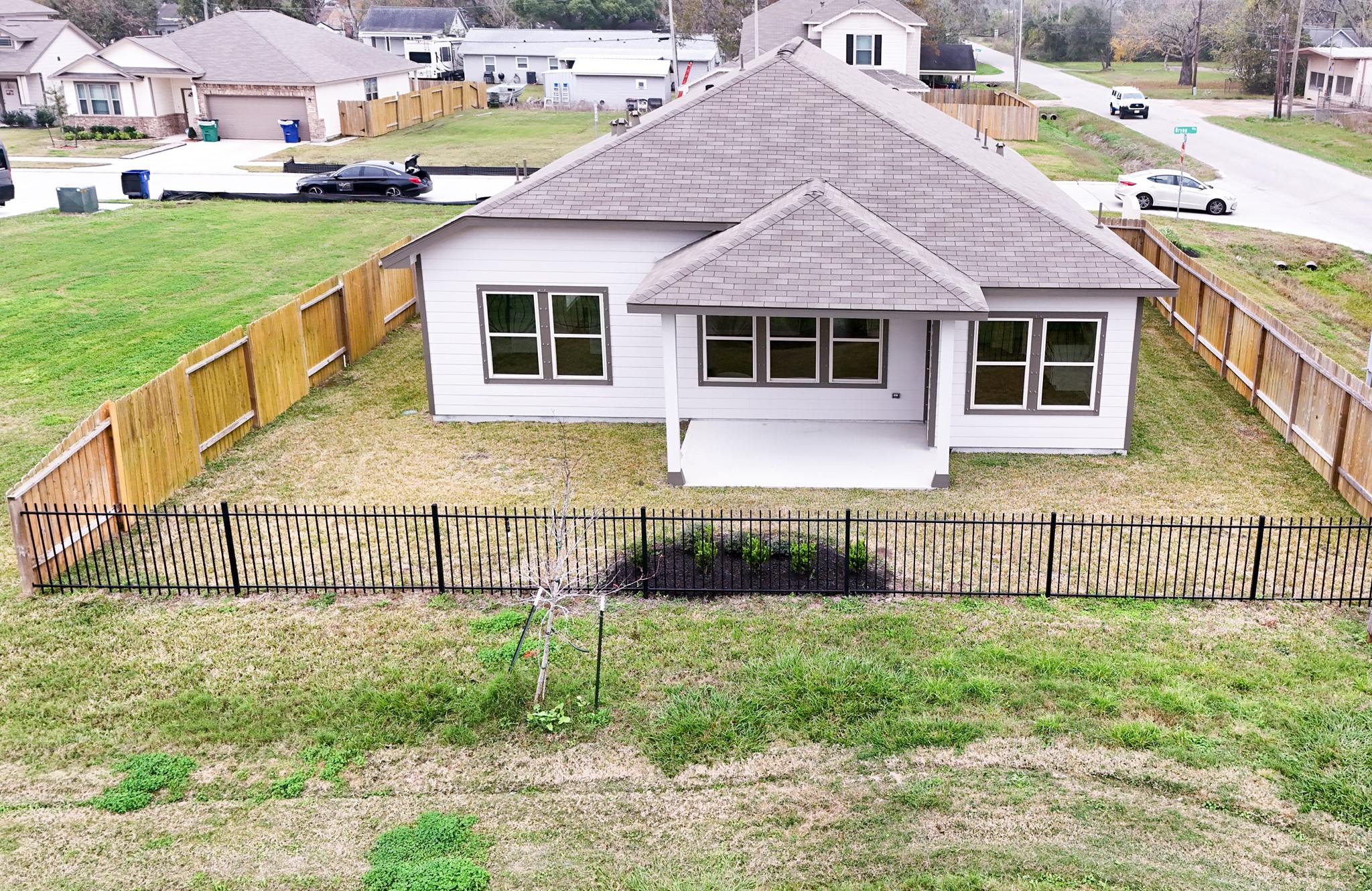 201 Bryan Way Angleton, TX 77515 - Photo 16 of 38 a front view of a house with a yard and fence
