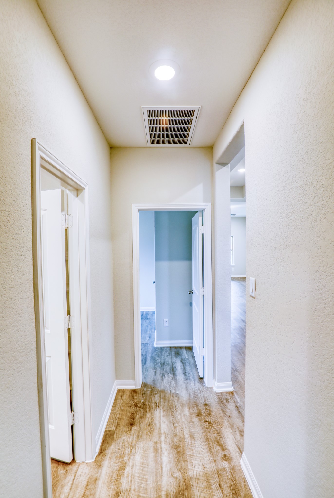 201 Bryan Way Angleton, TX 77515 - Photo 22 of 38 a view of hallway with wooden floor