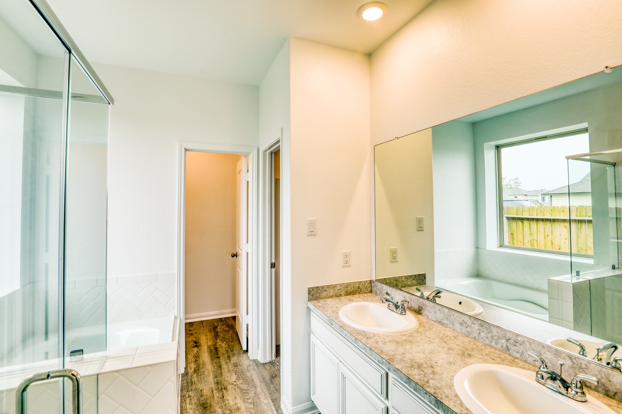 201 Bryan Way Angleton, TX 77515 - Photo 28 of 38 a bathroom with a granite countertop sink and a mirror