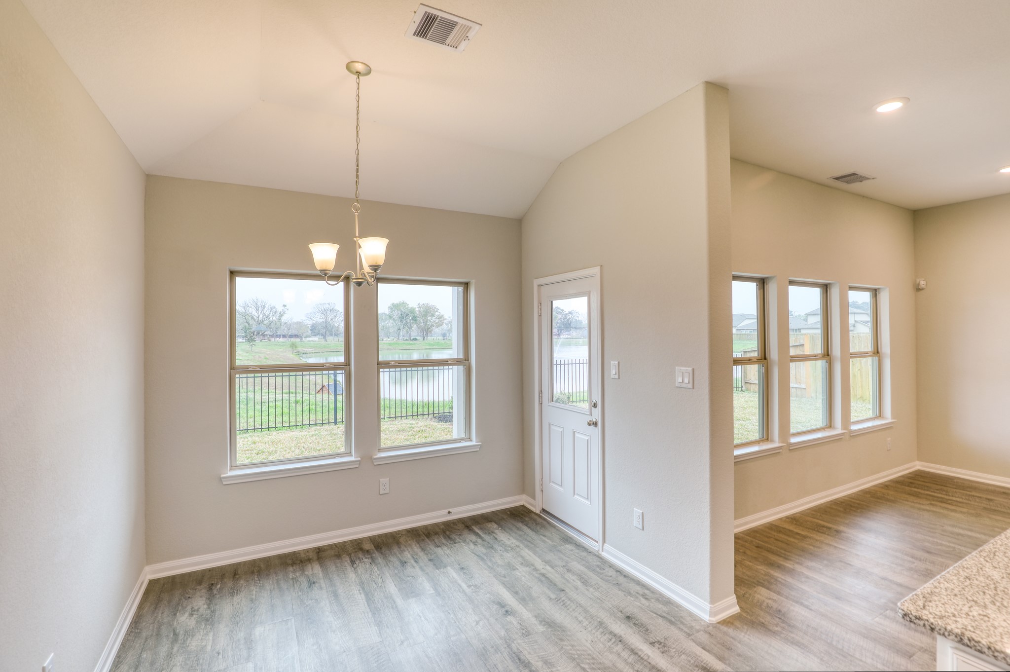201 Bryan Way Angleton, TX 77515 - Photo 31 of 38 a view of an empty room with wooden floor and a window