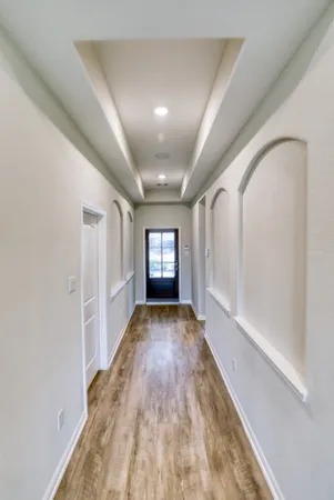 a view of kitchen with sink and wooden floor
