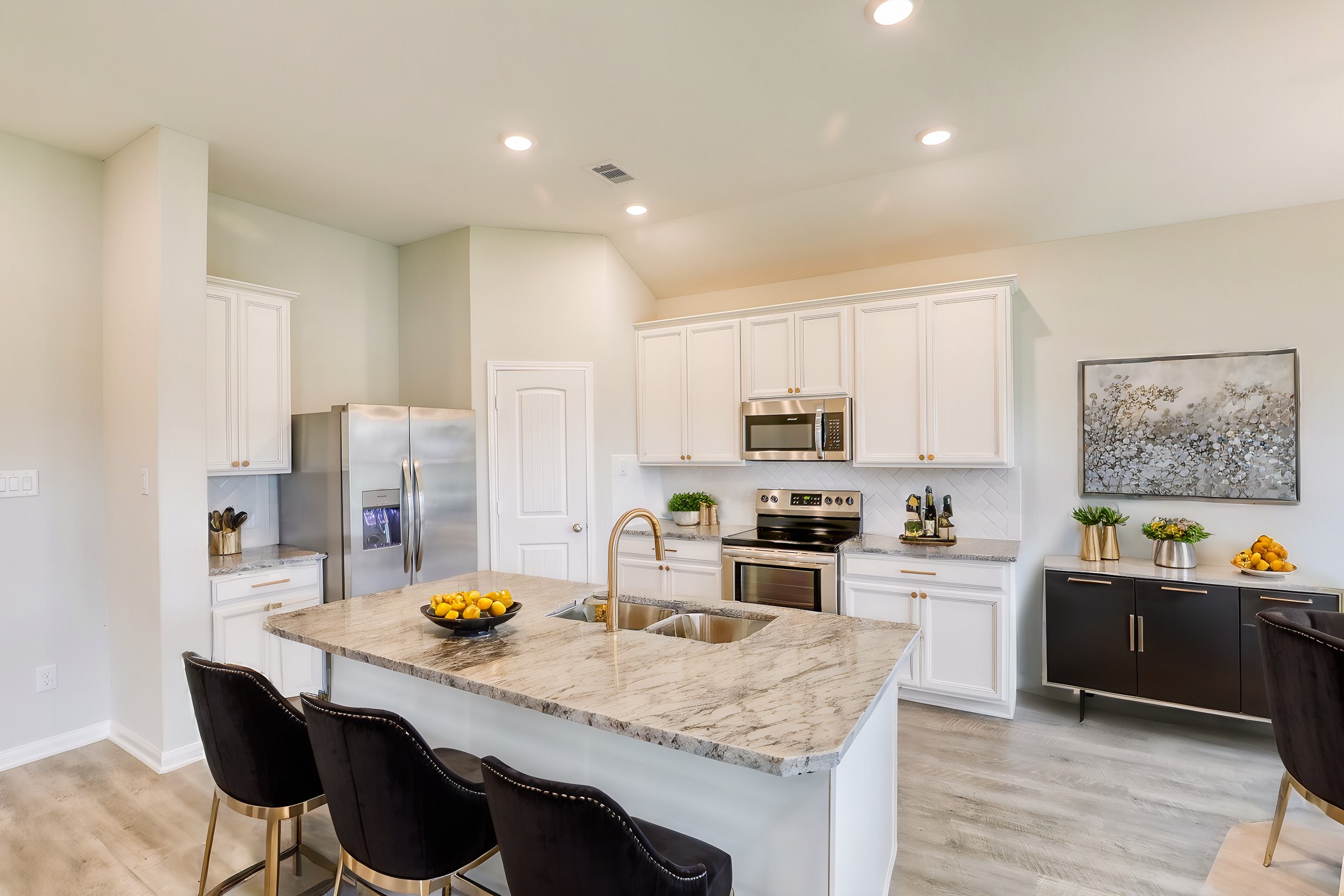 201 Bryan Way Angleton, TX 77515 - Photo 4 of 38 a kitchen with granite countertop a sink stove and cabinets