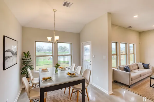 a view of a dining room with furniture window and outside view