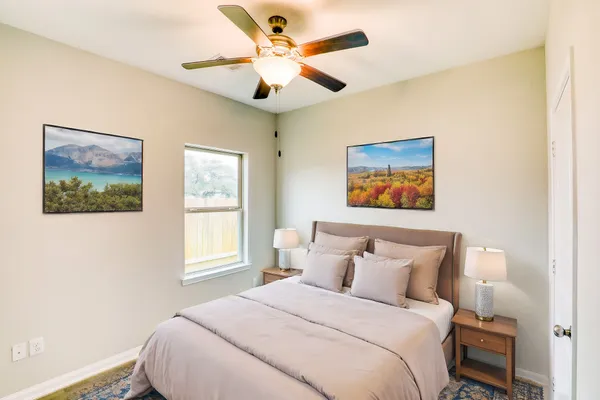 a bedroom with a bed and a window