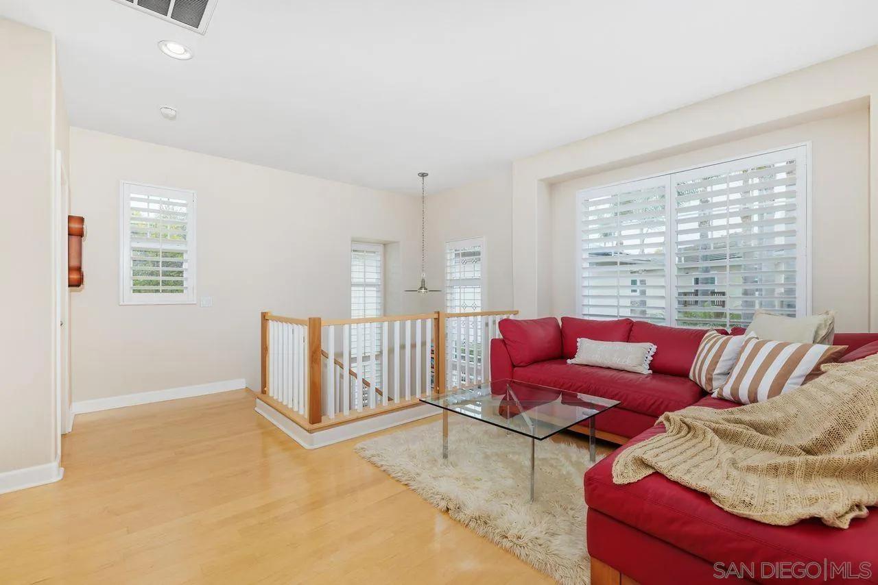 7390 Seafarer Place Carlsbad, CA 92011 - Photo 17 of 41 a living room with furniture and a large window