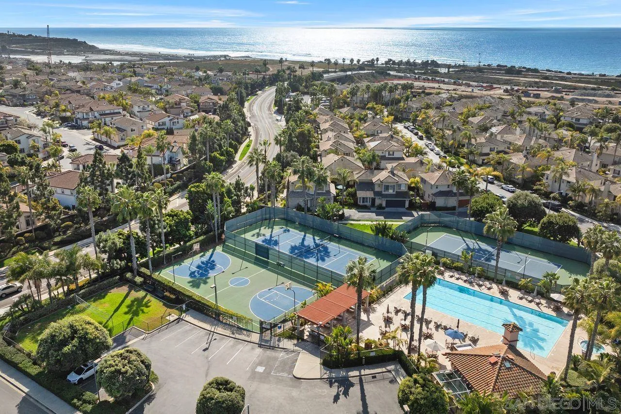 7390 Seafarer Place Carlsbad, CA 92011 - Photo 2 of 41 an aerial view of a residential houses with outdoor space and street view