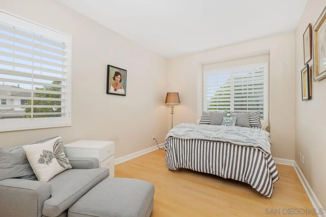 7390 Seafarer Place Carlsbad, CA 92011 - Photo 23 of 41 a bedroom with a bed and a couch