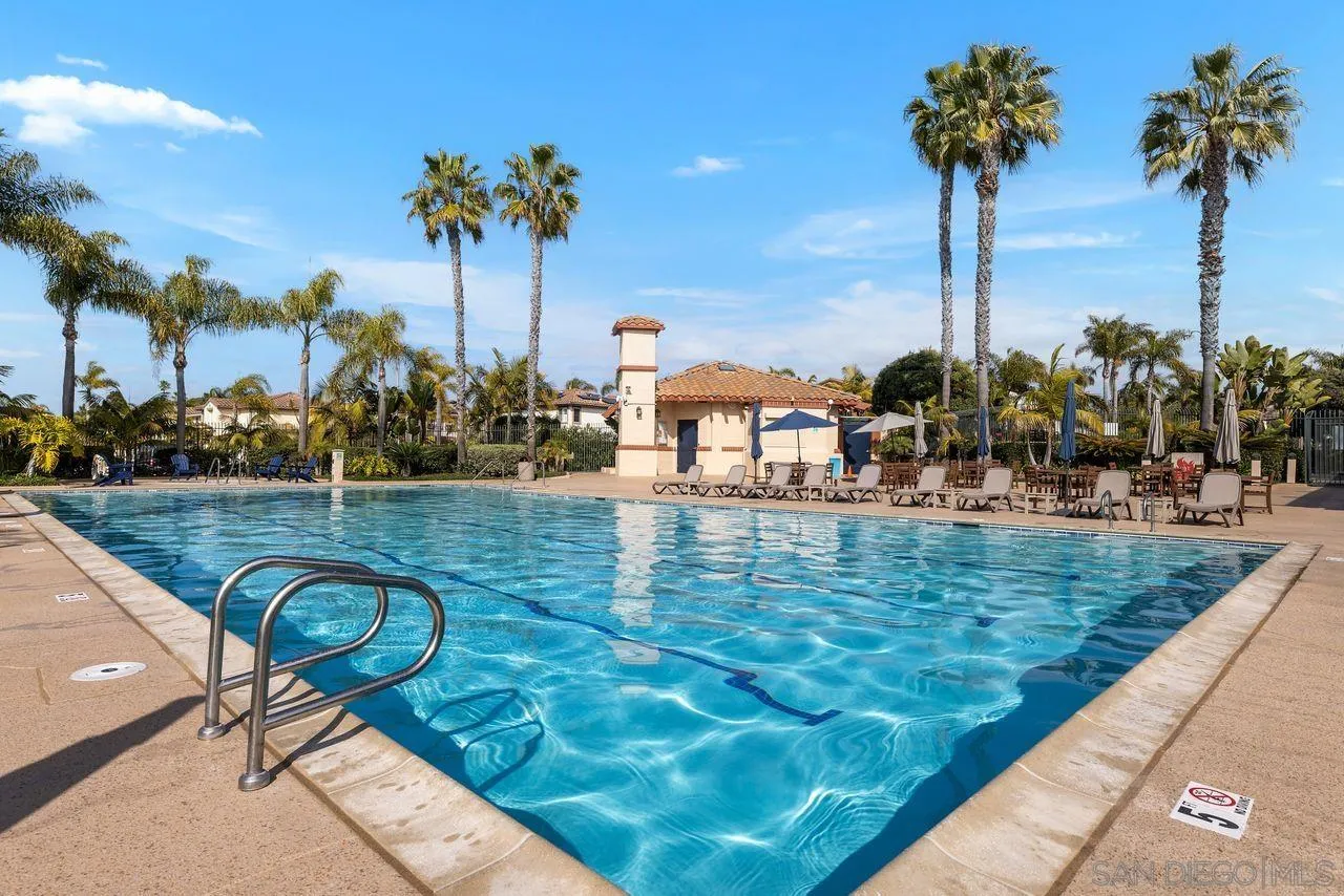 7390 Seafarer Place Carlsbad, CA 92011 - Photo 30 of 41 a view of a swimming pool with a table and chairs
