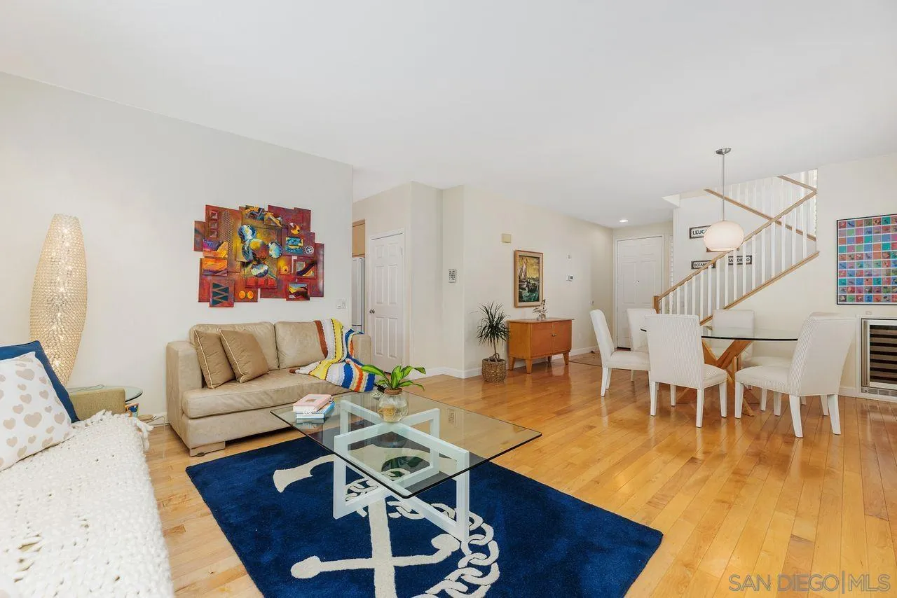 7390 Seafarer Place Carlsbad, CA 92011 - Photo 5 of 41 a living room with furniture and wooden floor