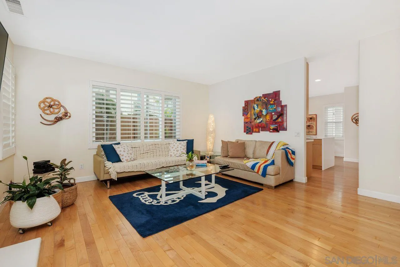 7390 Seafarer Place Carlsbad, CA 92011 - Photo 6 of 41 a living room with furniture window and wooden floor