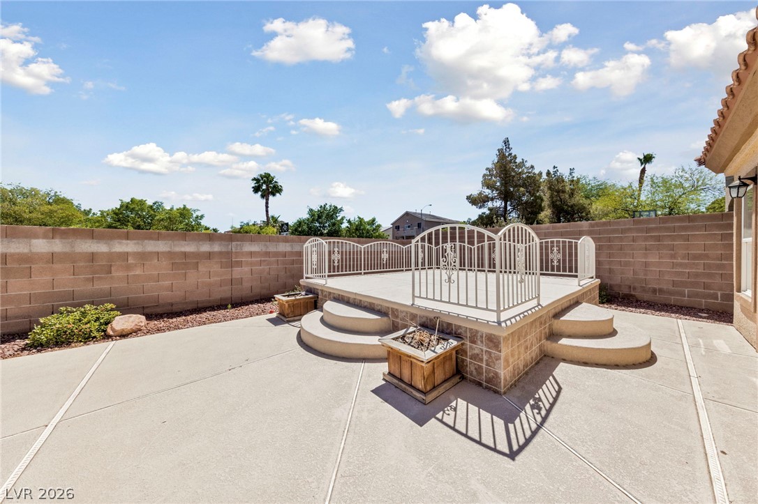 740 Aldo Rae Court, Unit NONE Henderson, NV 89052 - Photo 30 of 35 A private, elevated patio with elegant white railings provides an ideal space for outdoor enjoyment.