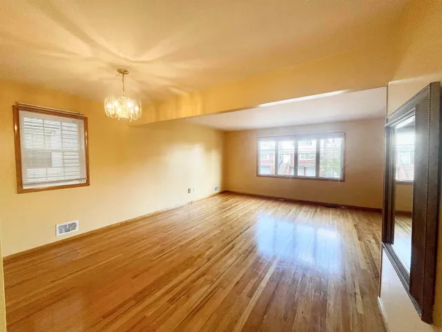 a kitchen with a refrigerator sink and cabinets